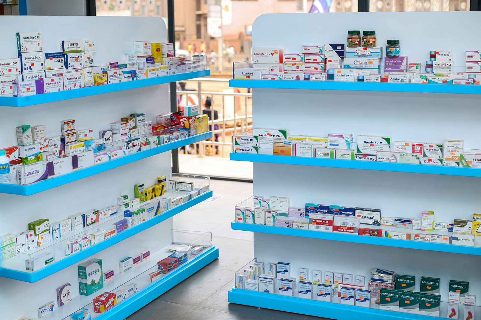 Bright, well-stocked shelves inside Rapha Chemists Pharmacy
